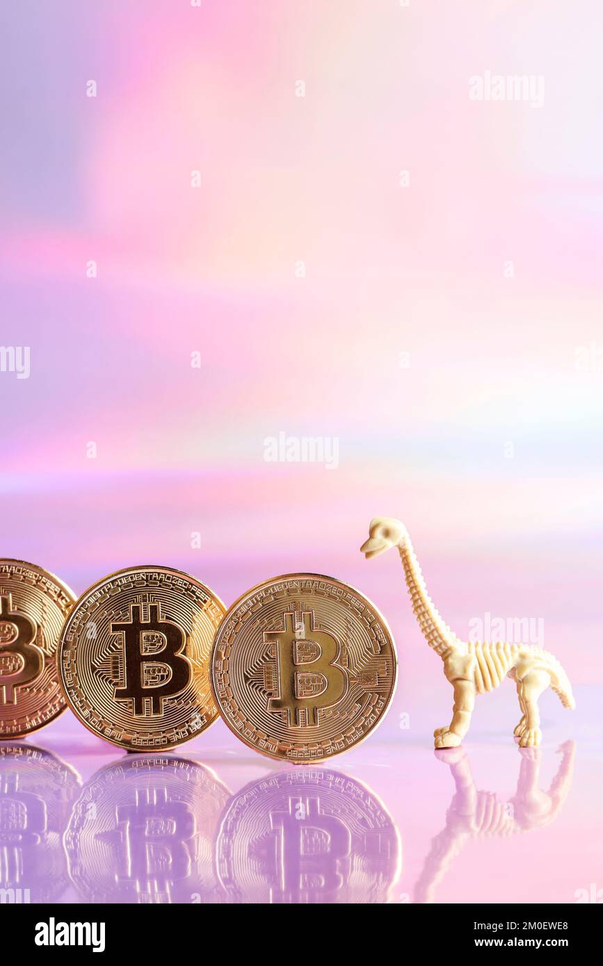 Golden bitcoin coins with dinosaur on neon background. digital currency, business style. Mining and trade bitcoin, evolution concept.copy space  Stock Photo