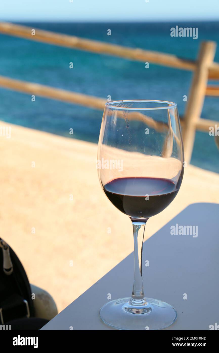 Glass Of Red Wine On The Terrace Of A Beach Bar In Santa Pola Alicante glass-of-red-wine-on-the-terrace-of-a-beach-bar-in-santa-pola-alicante