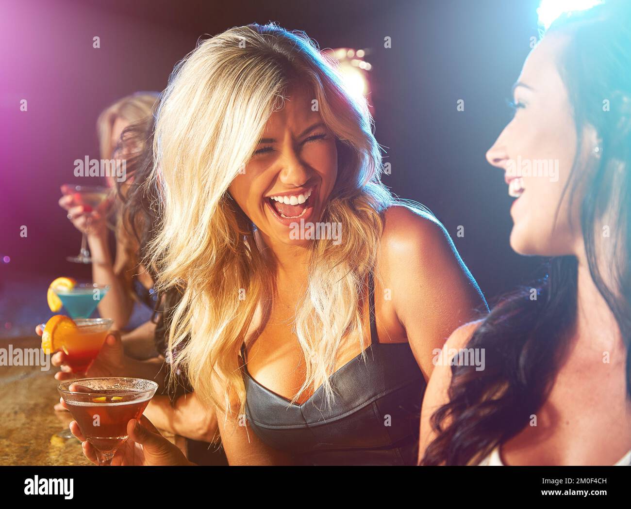 Happy woman, nightclub and drinks with friends for party, celebration or new years evening. Young girl, night club or happy hour, social drinking and Stock Photo