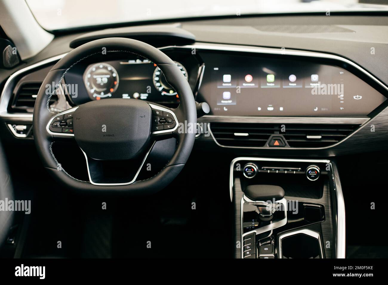 Dark luxury car Interior steering wheel, shift lever and dashboard