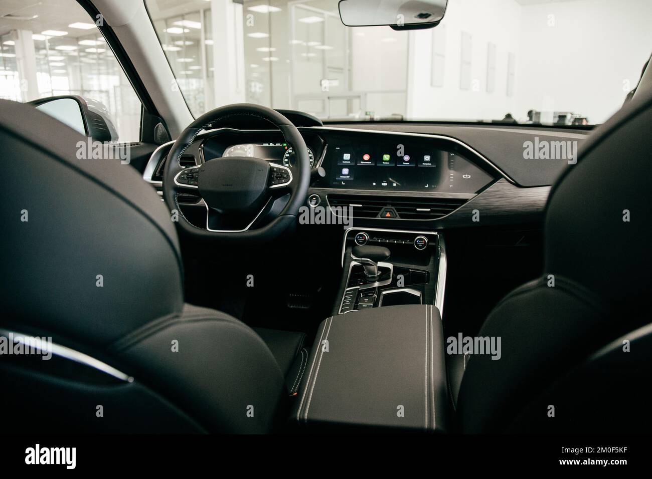 Dark luxury car Interior steering wheel, shift lever and dashboard