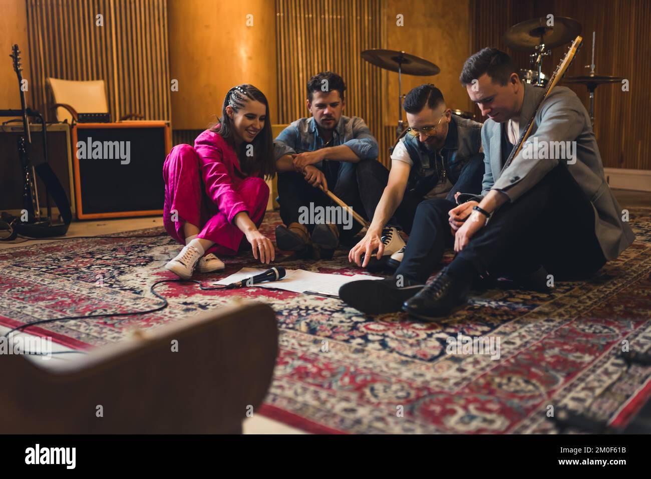 Music band members having a rehearsal with notes on the floor. High quality photo Stock Photo