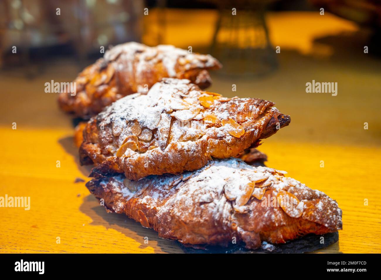 French sweet dessert pastry with almonds on display in french bakery