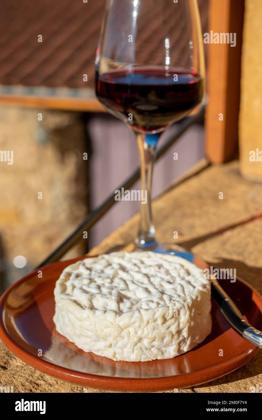 French wine and cheese pairing, glass of red beaujolais wine served