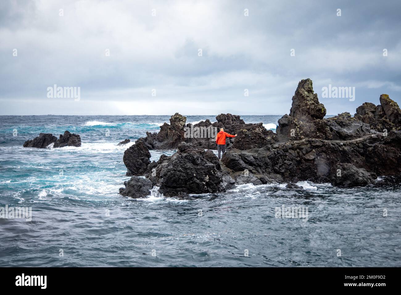 Rough coastline of São Jorge, Azores with black volcanic rock Stock Photo