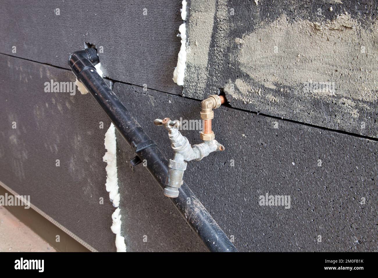 External wall Insulation waste and water pipes Stock Photo Alamy