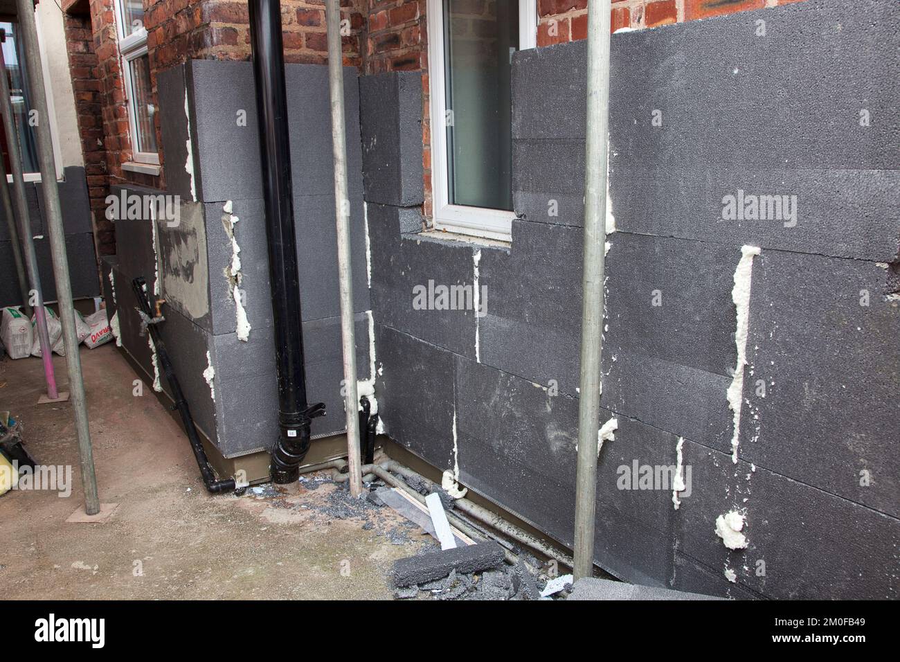 External wall insulation ground floor progress Stock Photo - Alamy