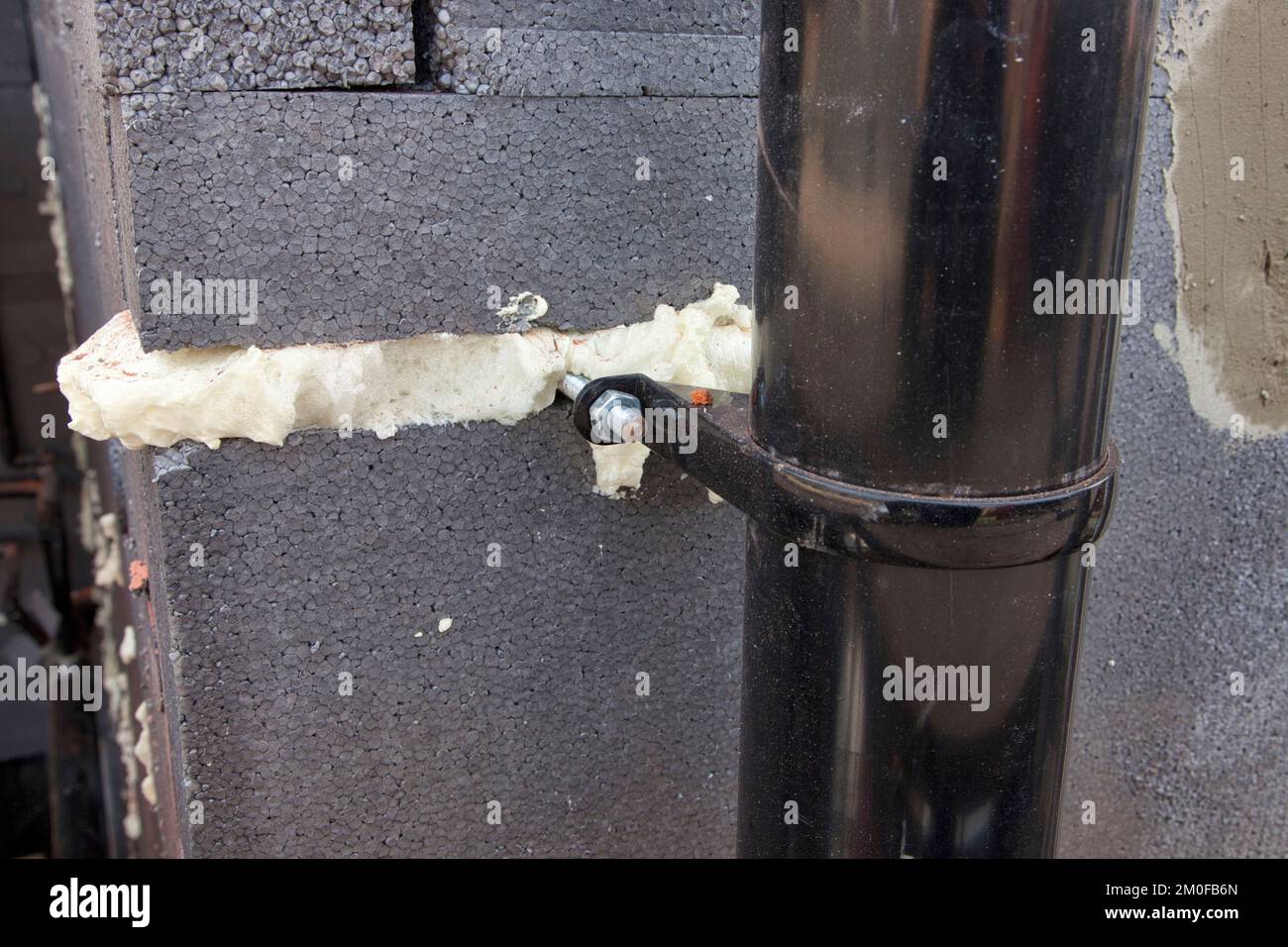 External wall insulation foam sealant used by pipe stand off Stock