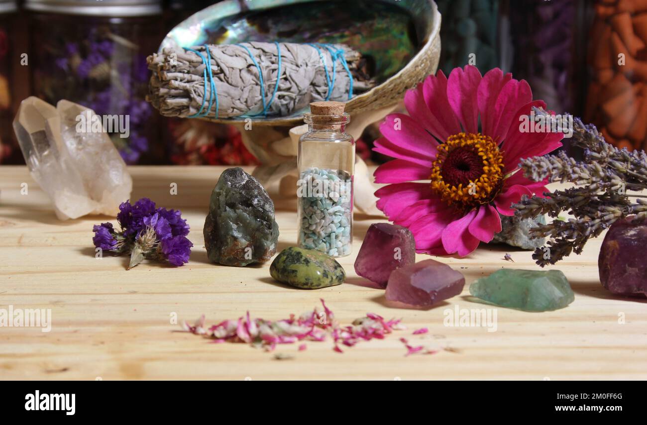 Dried Flowers and Crystal Chakra Stones on Meditation Altar Shallow DOF