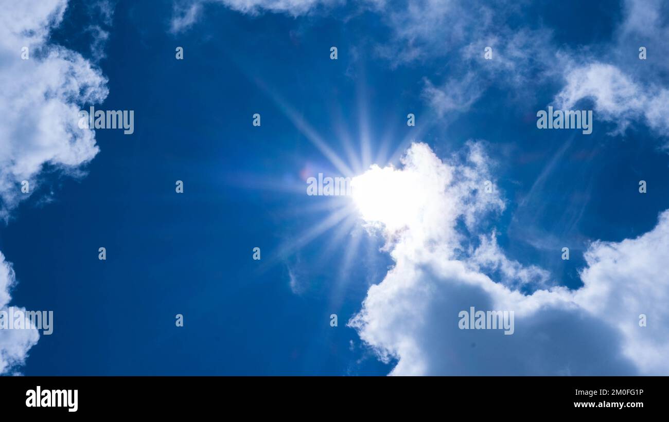 Aerial view of beautiful sky with clouds and sun on a summer day. Time ...