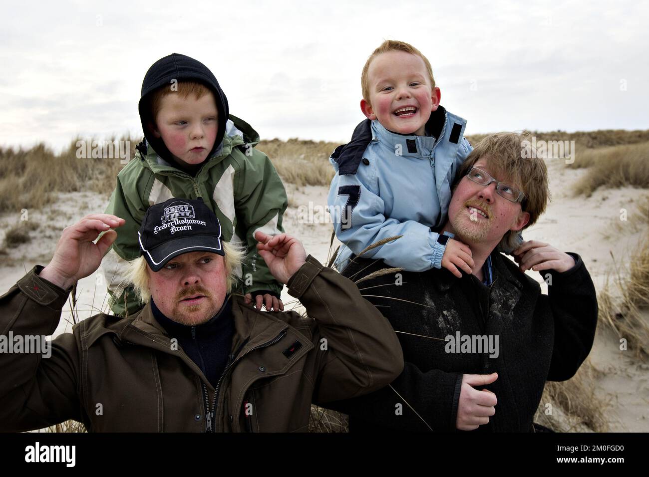 (R-L) Michael Nielsen and his son Marcus alongside Tommy Kallehauge and son Lucas. Twins Marcus and Lucas, born 48 minutes apart have two different fathers. Mum Charlotte Hilbrandt became pregnant by ex-husband Michael and new boyfriend Tommy when she slept with both men within 48 hours. Stock Photo