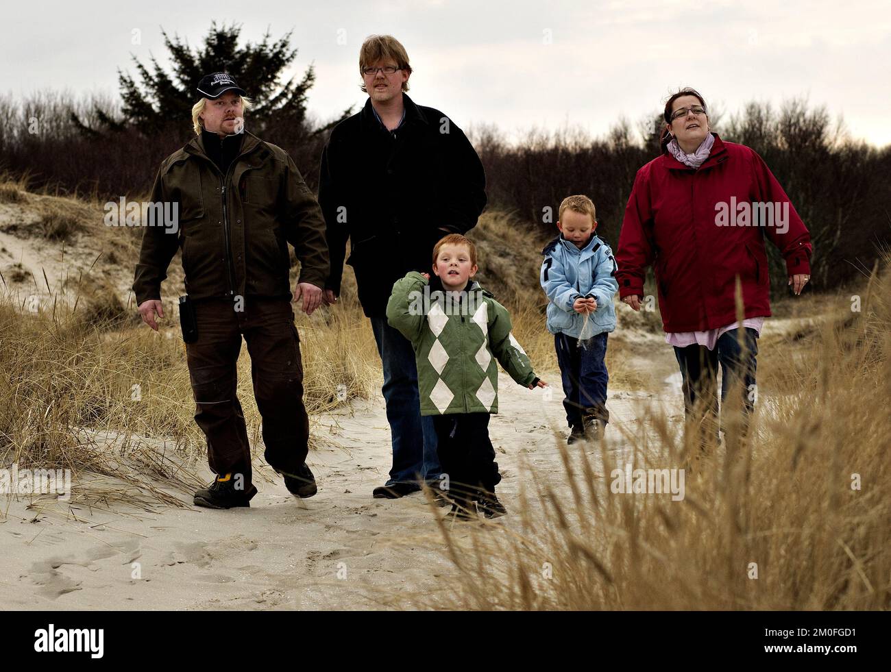 Michael Nielsen (second left) and his son Marcus (second right) alongside Tommy Kallehauge (left) and son Lucas (centre) with mother Charlotte Hilbrandt (right). Twins Marcus and Lucas, born 48 minutes apart have two different fathers. Mum Charlotte Hilbrandt became pregnant by ex-husband Michael and new boyfriend Tommy when she slept with both men within 48 hours. Stock Photo