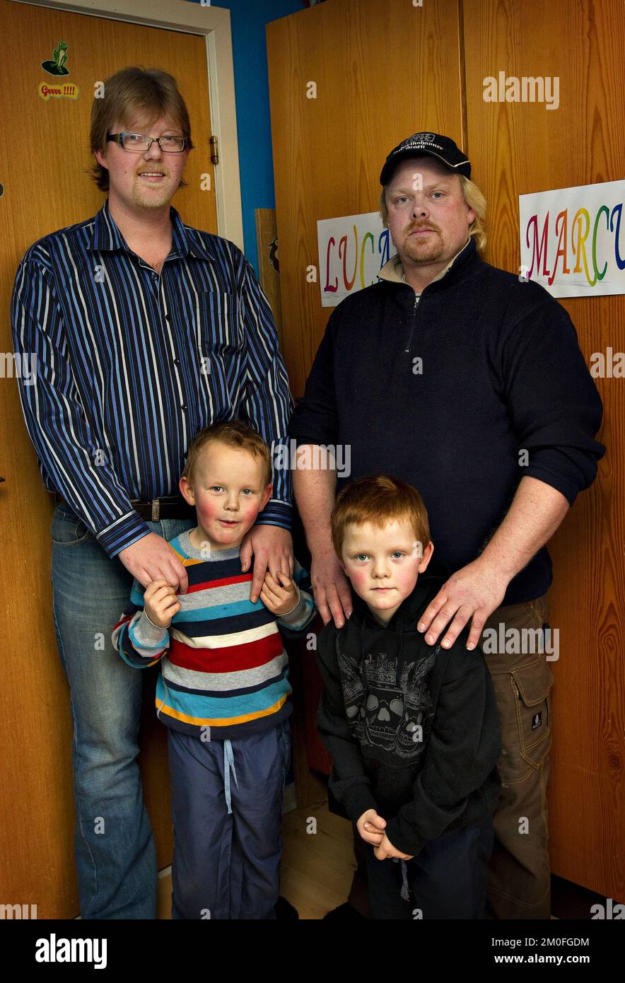 (L-R) Michael Nielsen and his son Marcus alongside Tommy Kallehauge and son Lucas. Twins Marcus and Lucas, born 48 minutes apart have two different fathers. Mum Charlotte Hilbrandt became pregnant by ex-husband Michael and new boyfriend Tommy when she slept with both men within 48 hours. Stock Photo