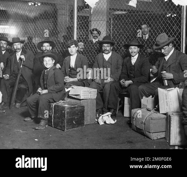 Group of Italian arrivals ready to be processed in Ellis Island. Stock Photo