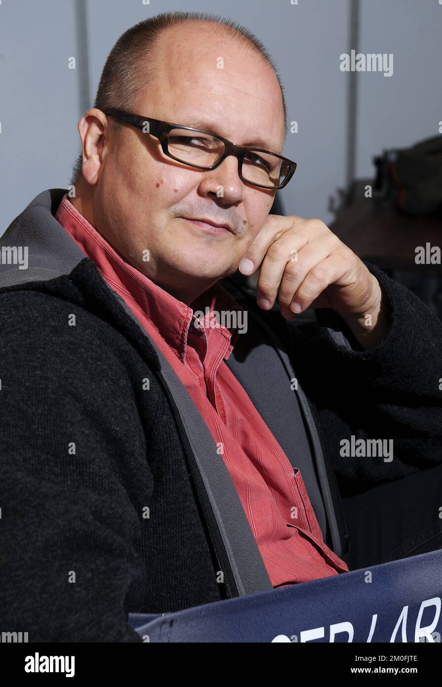 Danish film director Birger Larsen poses for photographs after attending the premiere of his film 'Super Brother' in Denmark. Stock Photo