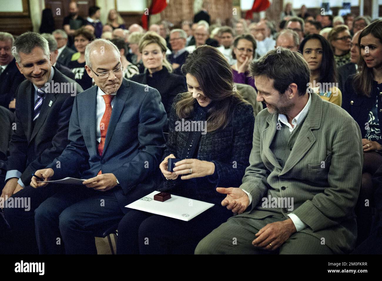 On Monday, October 29, 2012, Crown Princess Mary of Denmark was at theTown Hall in Copenhagen to attend the Christmas Seal Foundation launch of the 2012 Christmas Seal. The money from the sale of Christmas Seal will be donated to four Christmas Seal Homes, which serves as a temporary home for children who need help to break the vicious circle such as obesity or bullying.This yearÂ’s seal was designed by artist, Carl Quist MÃ¸ller, and the seal will be available for purchase on Tuesday, October 30, 2012. (Liv Hybye/POLFOTO) Stock Photo