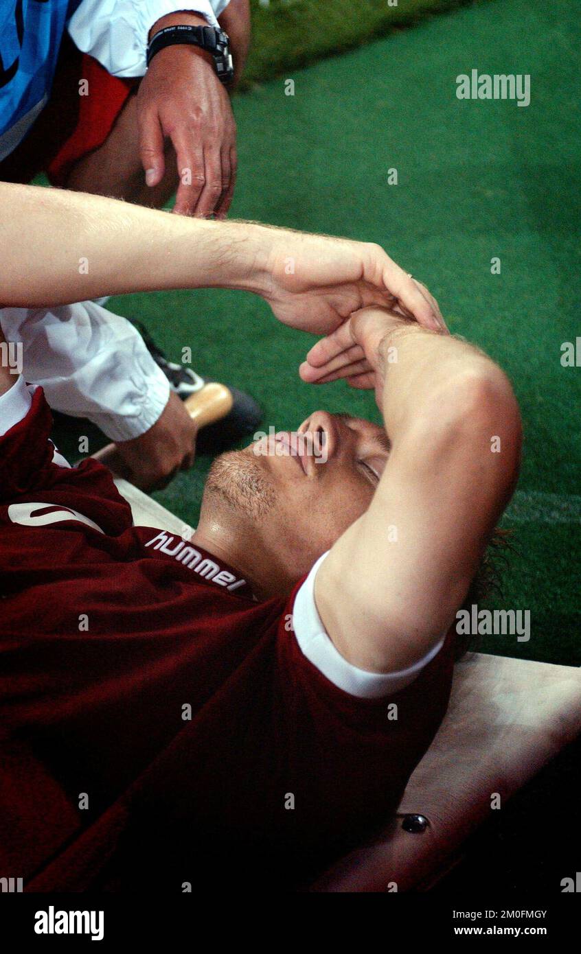 PA PHOTOS / POLFOTO - UK USE ONLY: Danish defender Thomas Helveg is forced to leave the field with a head injury following England's Rio Ferdinand's 5th minute goal, in the second round of the World Cup in Japan. Stock Photo