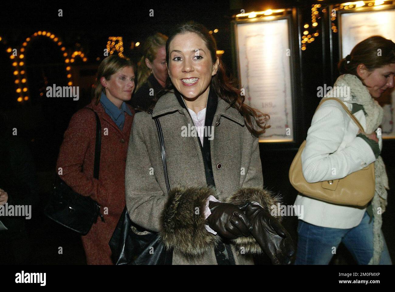 PA PHOTOS/POLFOTO - UK USE ONLY : Mary Donaldson, girlfriend of Crown Prince Frederik in Tivoli. Mary was there with two of her girlfriends, watching the christmas cabaret from the 20th London Toast Theatre, 'Bent the Gladiator'. It is the 10th christmas that the crazy Englishmen entertains the Danes. When asked about the play Mary replied 'fantastic' and that was about all she said to the press. Stock Photo