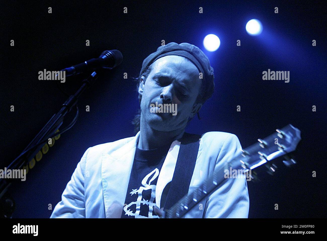 Travis front man Fran Healy playing in 'Valby hallen'. Only half of the tickets were sold, but the crowd and the critics were happy with the band and their performance. Stock Photo