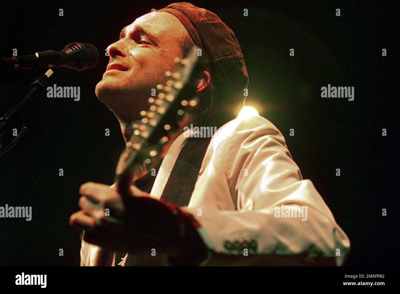 Travis front man Fran Healy playing in 'Valby hallen'. Only half of the tickets were sold, but the crowd and the critics were happy with the band and their performance. Stock Photo