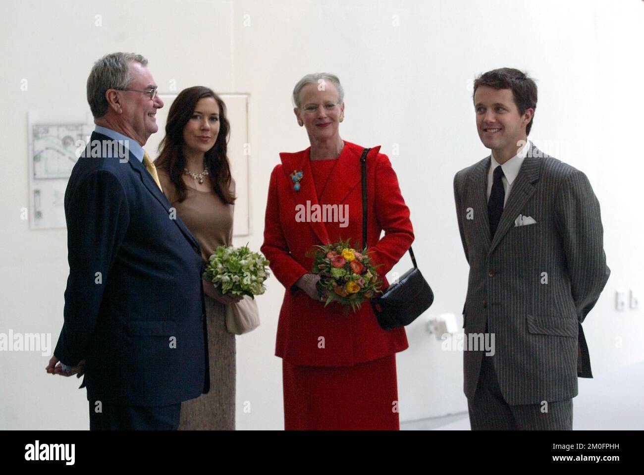 Royal opening of the art museum 'ARoS' in Aarhus, the second largest city in Denmark. Mary Donaldson, crown prince Frederik, queen Margrethe and prince Henrik standing in a street of the museum. Queen Margrethe opened the museum wednesday evening 7 april 2004. 500 people were invited for the opening. Thursday the museum was opened for the public. The building costs for the museum amounts to 400.000 euro. Stock Photo