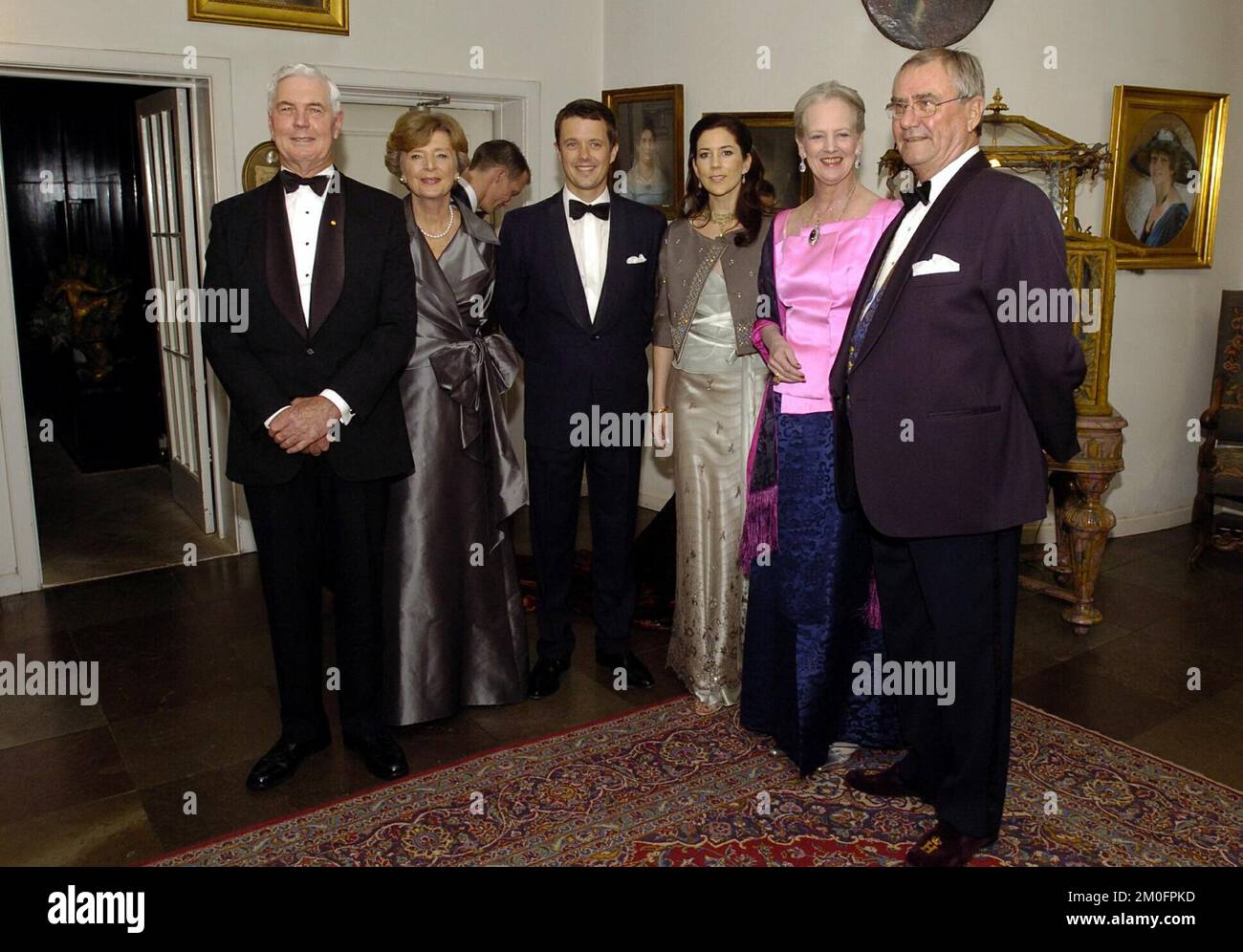 The Governor-General of Australia hosted an official dinner for the Danish royal family and invited guests. Left ro right: The Governor-General of Australia, Major-General Michael Jeffery, and his wife Marlena Jeffery with Crown Prince Frederik, Miss Mary Donaldson, Queen Margrehe II and the Prince Consort Henrik. Mary Donaldson and the Crown Prince will marry Friday, May 14. Stock Photo