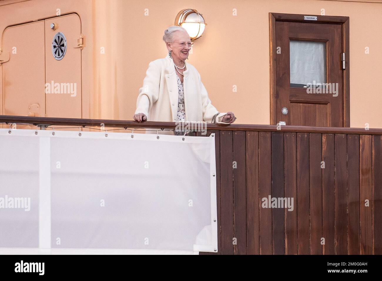 Her Majesty Queen Margrethe continued her summer cruise on the Royal Ship Dannebrog in Nyborg. She was shown a ballet performance, visited Nyborg Slot, an archeological dig, the monument FORSHAVN and the Nyborg Arts and Crafts Association. Stock Photo