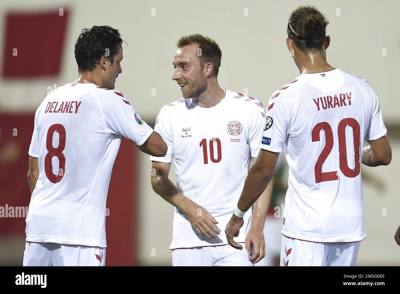 Thomas Delaney and Yussuf Yurary Poulsen congratulate Christian Eriksen scroring his side's second goal of the game during the European Championship qualifying match between Gibraltar-Denmark at Victoria Stadium Gibraltar Stock Photo