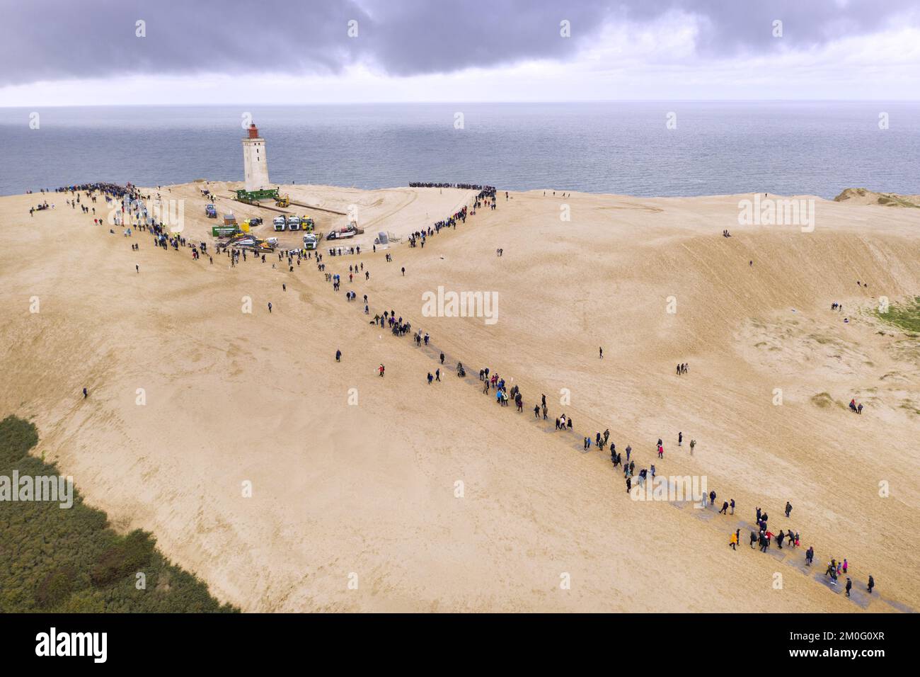 Rubjerg Knude Lighthouse moves on 'roller skates' and metal rails in Loenstrup, North Jutland, Denmark, on Tuesday, October 22, 2019. The 23 meter high and 120 year old Lighthouse is moved approx. 70 meters inland. The Lighthouse had to be moved because the waves of the sea annually eat about two to four meters of the coast in front of the lighthouse. If the lighthouse were not moved, it would crash into the sea in five to ten years. Stock Photo