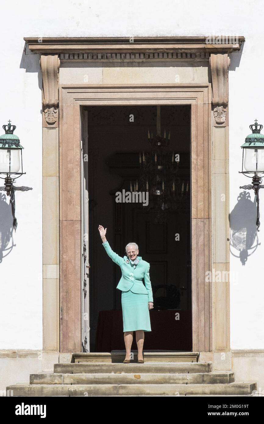 Queen Margrethe waves to the many people who had gathered in front of Fredensborg Palace to wish her happy birthday, as she turns 80 years old. Thursday, April 16, 2020. Due to the COVID-19 crisis all original plans of celebration has been cancelled. However, the special birthday today is still being celebrated and marked in various ways across Denmark. (Photo: Ã“lafur Steinar Gestsson/Ritzau Scanpix) Stock Photo