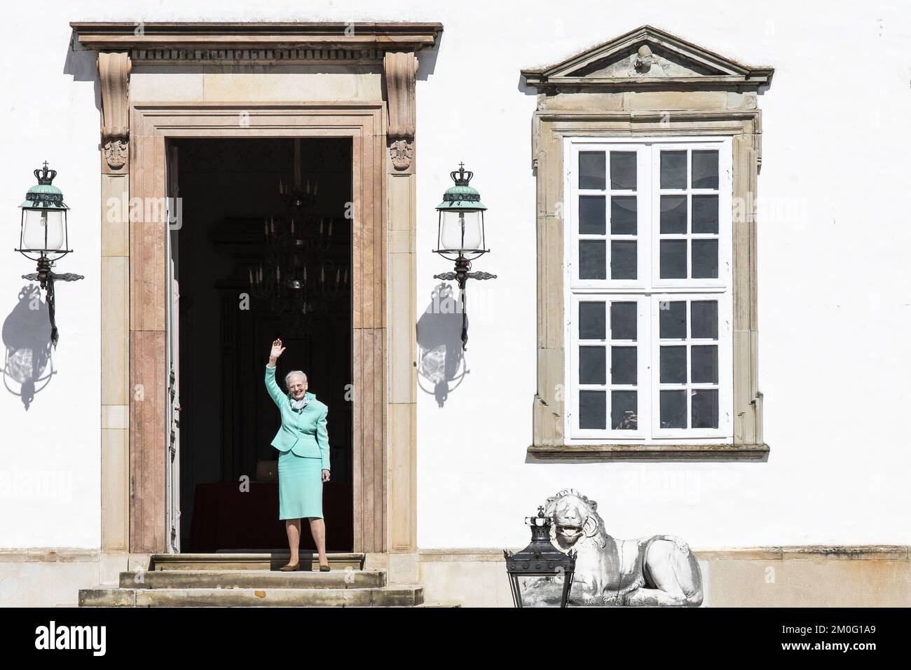 Queen Margrethe waves to the many people who had gathered in front of Fredensborg Palace to wish her happy birthday, as she turns 80 years old. Thursday, April 16, 2020. Due to the COVID-19 crisis all original plans of celebration has been cancelled. However, the special birthday today is still being celebrated and marked in various ways across Denmark. (Photo: Ã“lafur Steinar Gestsson/Ritzau Scanpix) Stock Photo