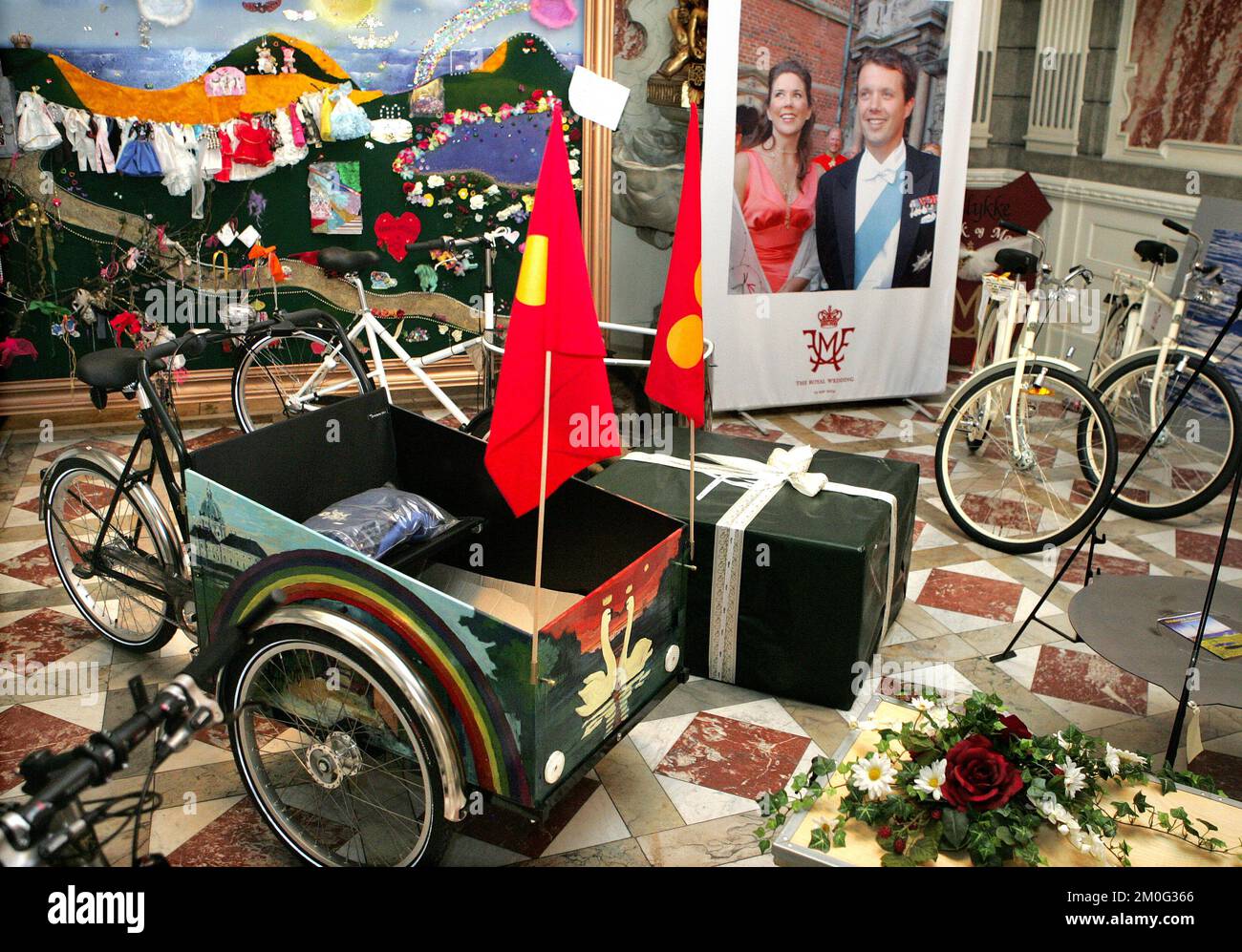 The Crown Prince Couple, Crown Prince Frederik and Crown Princess Mary, were gifted a Christiania bike on the occasion of their wedding in 2004. In June 2004, the newly wed royals exhibited their many gifts, including the Christiania bike, at Christiansborg in Copenhagen. Tuesday, June 15, 2004. Christiania Turns 50: Freetown Christiania first saw daylight on September 26, 1971, when a group of people in search for an alternative way of living occupied an abandoned military base on Christianshavn in Copenhagen. On Sunday, September 26, 2021, the self-proclaimed freetown celebrates its 50th bir Stock Photo