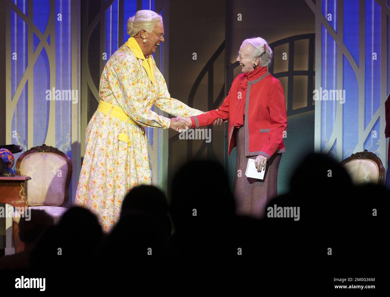 Queen Margrethe Surprising Danish revue icon Ulf Pilgaard on stage, as he retires from the revue scene, after 40 seasons. Sunday, October 3, 2021. The 80-year-old actor appeared on stage, wearing a yellow dress portraying the Queen Margrethe, when the real Queen appeared on stage and thanked him for his many parodies of her. (Photo: Keld Navntoft/Ritzau Scanpix) Stock Photo