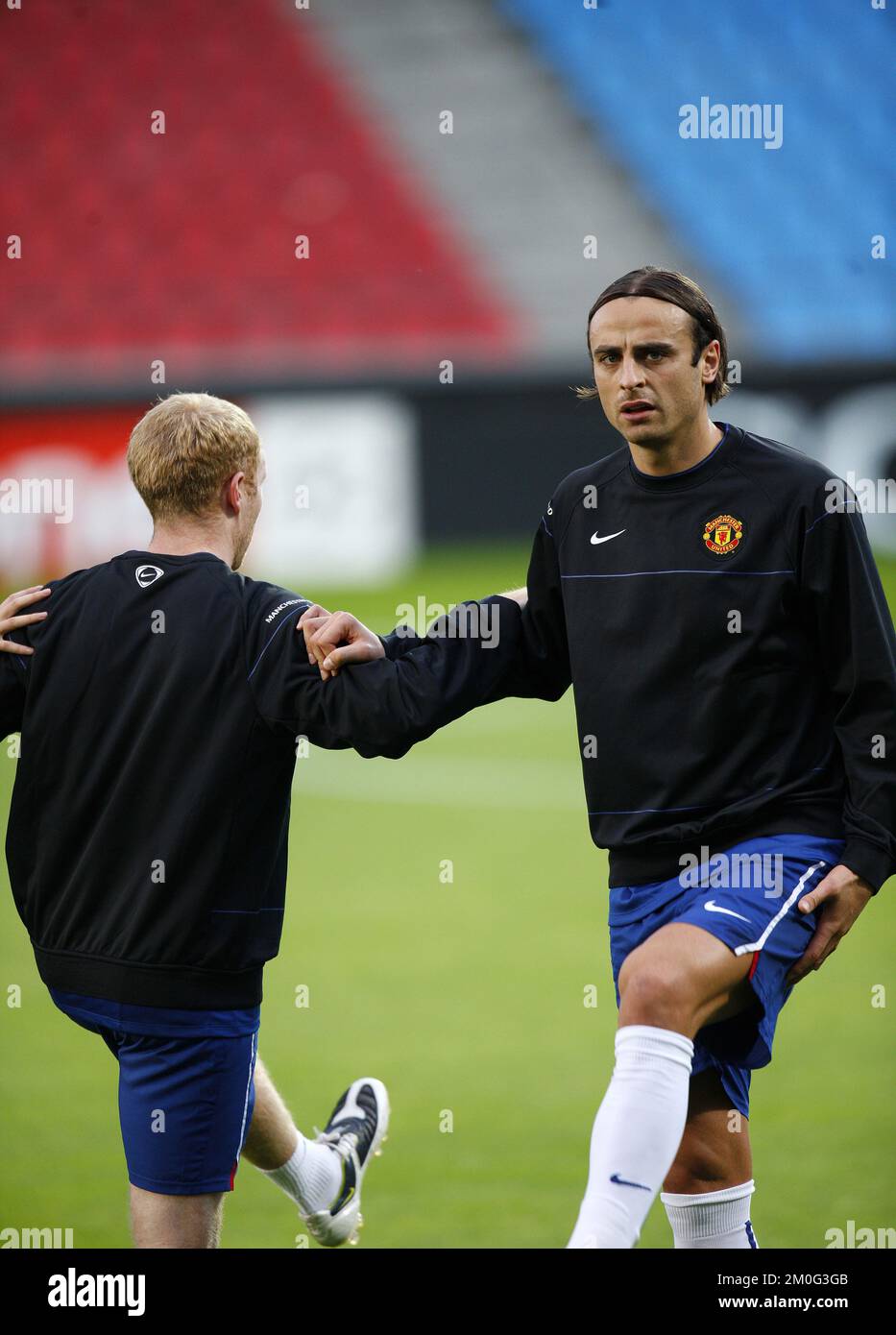 Manchester United players Dimitar Berbatov, right, and Paul Scholes, left, are seen during a training session Monday Sept. 29, 2008 in Aalborg, ahead of their Champions League match against Danish team Aalborg on Tuesday in Aalborg, Denmark. (AP Photo/Polfoto/Mick Anderson) ** DENMARK OUT ** Stock Photo