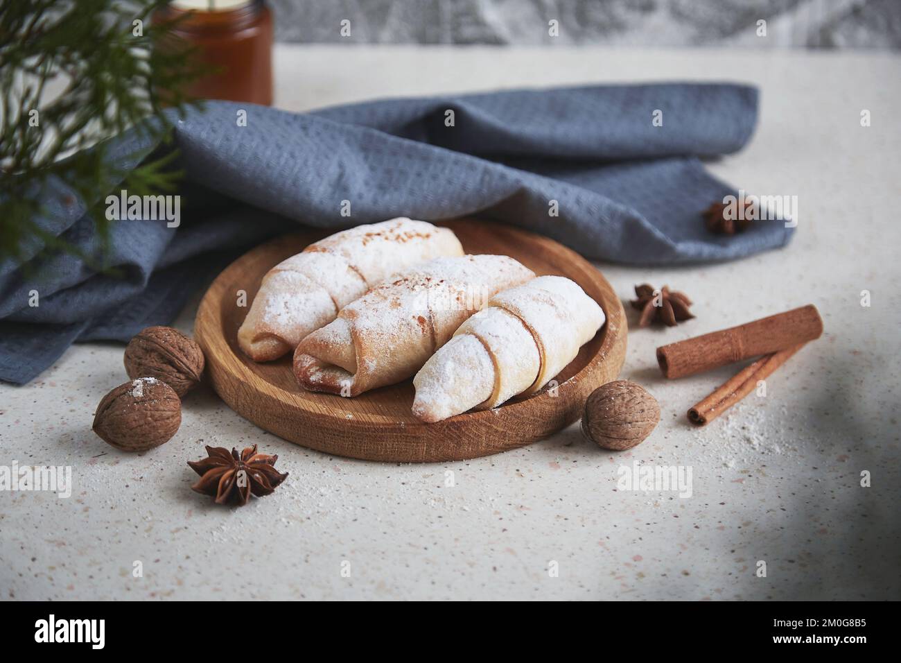 Classical atmospheric Christmas crescent bagels with cinnamon sticks, star anise and walnuts. Stock Photo