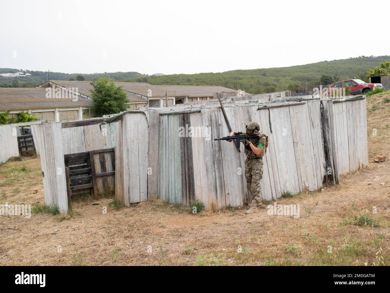 Airsoft player in offensive tactical position advances to take