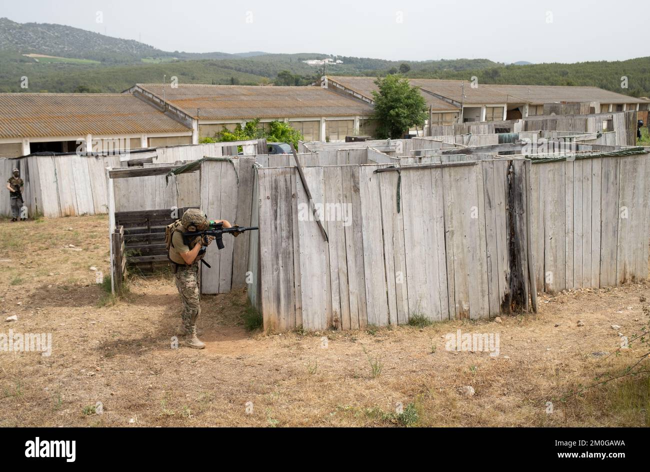 Airsoft player in offensive tactical position advances to take