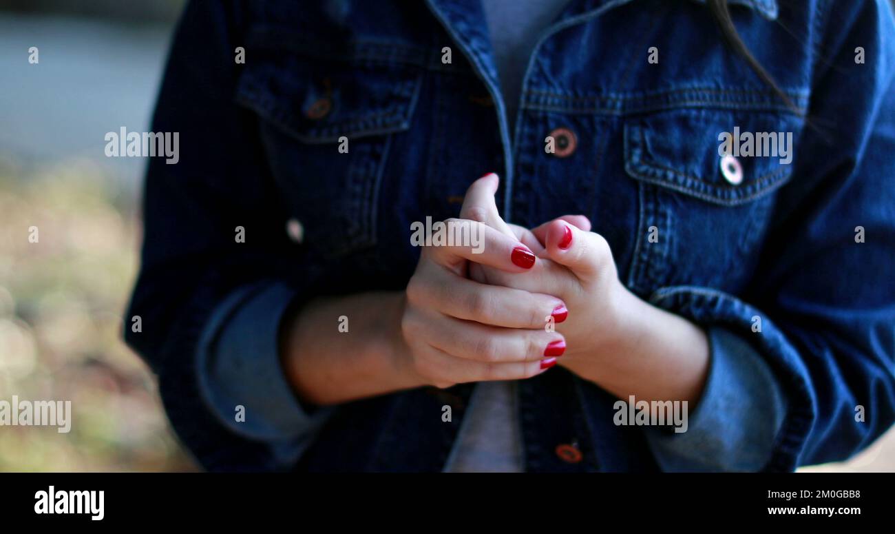 Anxious girl fidgeting with hands cracking knuckles Stock Photo Alamy