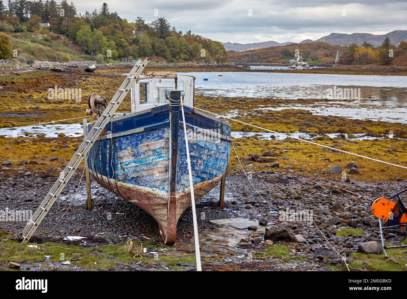 Old fishing vessel on the beach at low tide Badachro, Gairloch ...