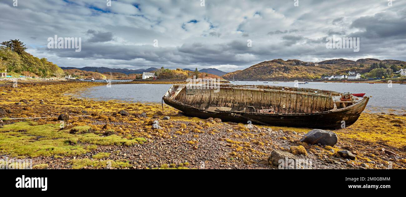 Old fishing vessel on the beach at low tide Badachro, Gairloch ...