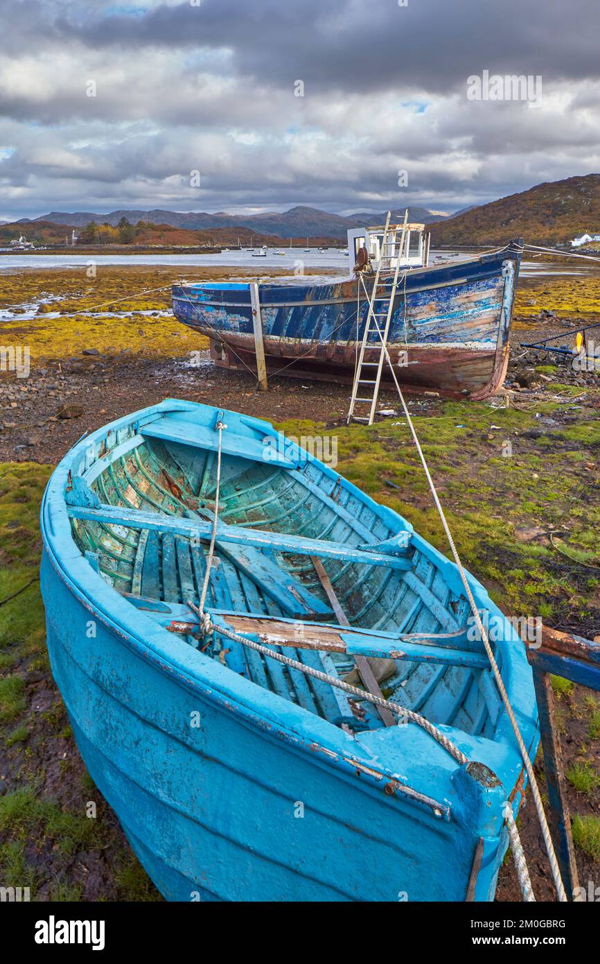 Two old fishing vessels on the beach at low tide Badachro, Gairloch ...