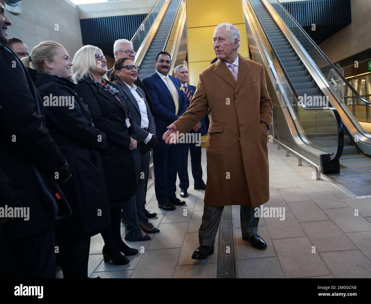 King Charles III meets easyJet staff during a visit to Luton Airport to