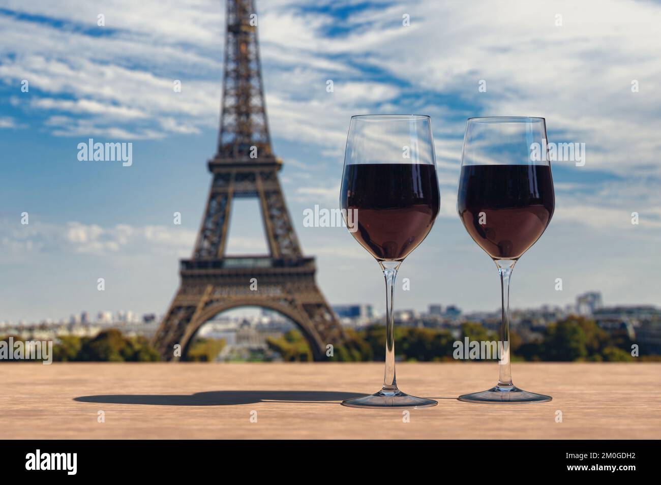 Two glasses of wine on Eiffel tower and Paris skyline background Stock