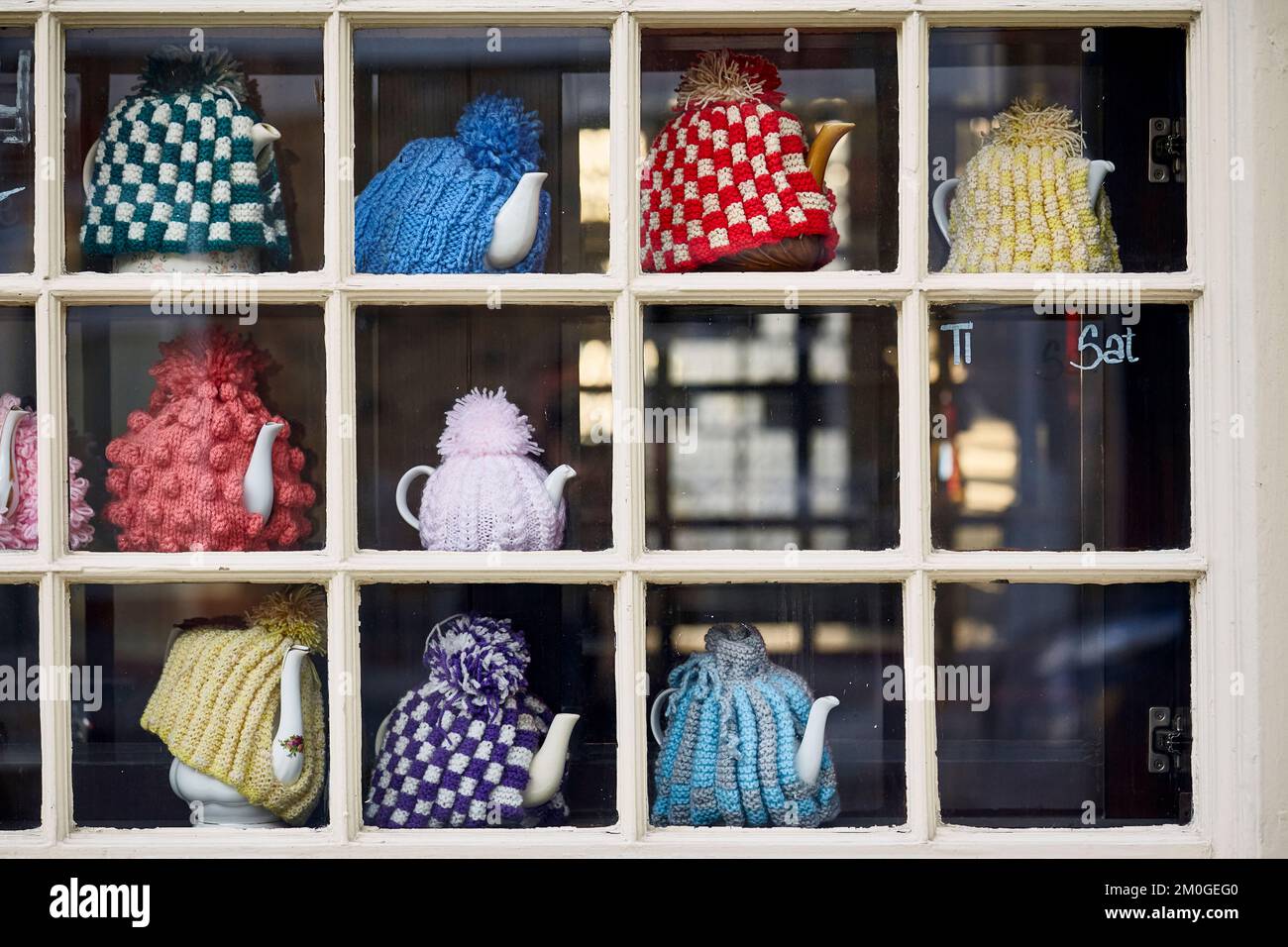 Window display with Tea pots with Tea cosy's, London, UK. Stock Photo