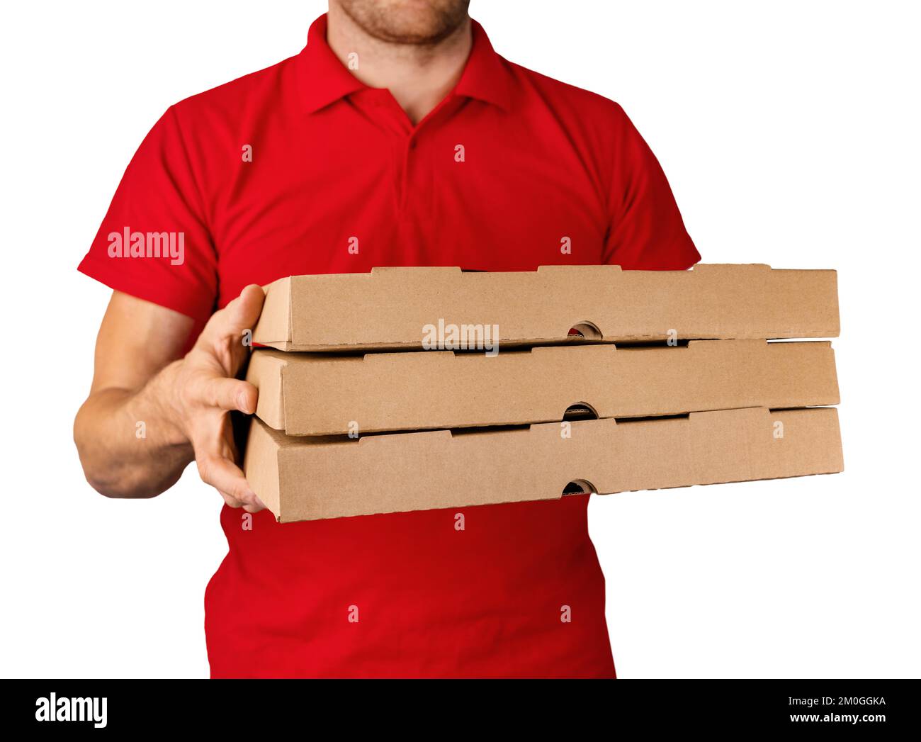 delivery man in red uniform with pizza boxes in hands isolated on white background Stock Photo
