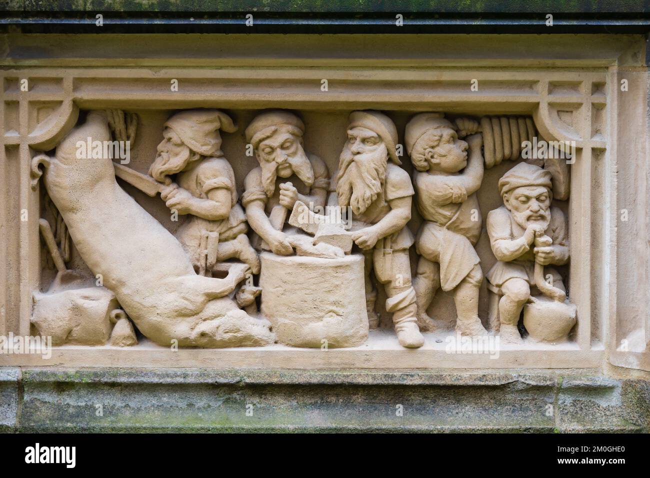 Heinzelmannchenbrunnen statue of Gnomes of Cologne folklore legend. Am Hof, Cologne Koln, West Germany. Stock Photo