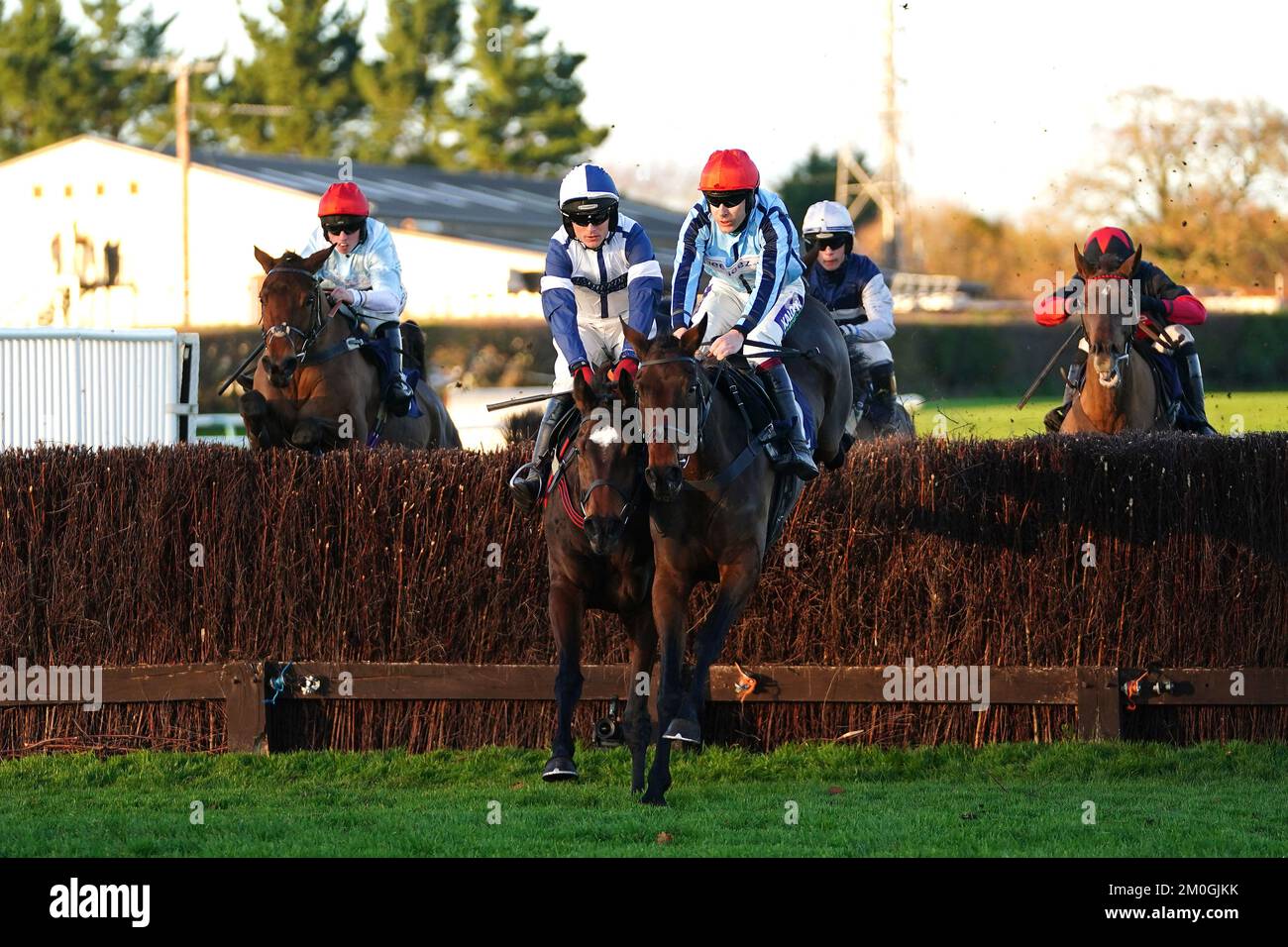 Swincombe Fleat ridden by jockey Aidan Coleman (left) and Bolintlea ridden by jockey Charlie Hammond during the At the Races App Expert Tips Mares' Novices' Handicap Chase at Fontwell Park Racecourse. Picture date: Tuesday December 6, 2022. Stock Photo