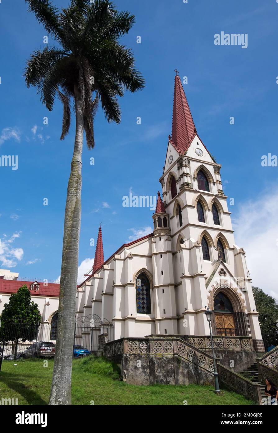 Palm tree and church of La Merced in the urban center of San José in Costa Rica Stock Photo