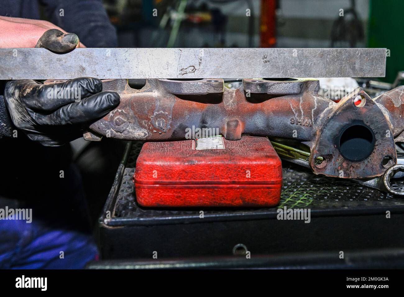 Checking the alignment of the exhaust manifold of a diesel engine Stock