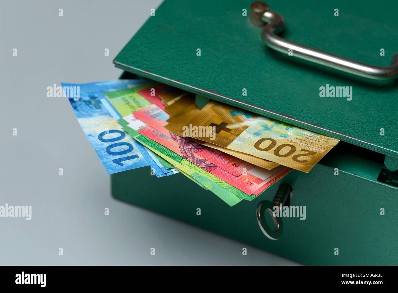 Cash box and Swiss banknotes, money, banknotes Stock Photo